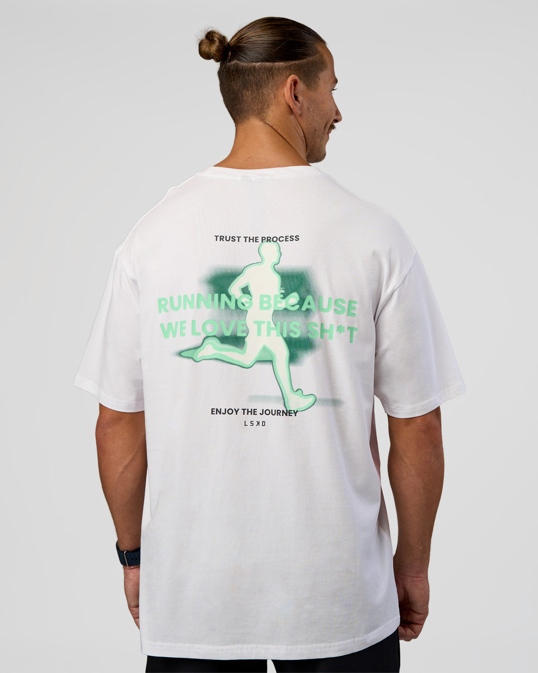 Man wearing High Run FLXCotton Oversized Tee - White-Jelly Mint | Model:Jaiden | Size:M