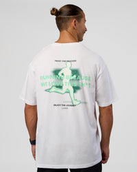 Man wearing High Run FLXCotton Oversized Tee - White-Jelly Mint | Model:Jaiden | Size:M