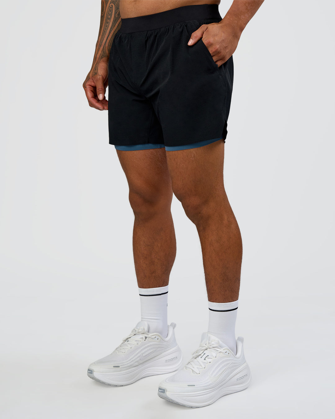 Man wearing Hybrid Lined 5" Short - Black-Indigo | Model:Daarian | Size:M