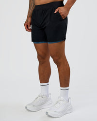 Man wearing Hybrid Lined 5" Short - Black-Indigo | Model:Daarian | Size:M