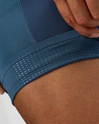 Man wearing Hybrid Lined 5" Short - Black-Indigo | Model:Daarian | Size:M