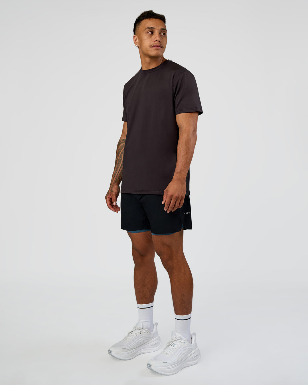 Man wearing Hybrid Lined 5" Short - Black-Indigo | Model:Daarian | Size:M