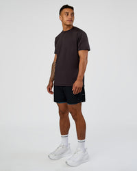 Man wearing Hybrid Lined 5" Short - Black-Indigo | Model:Daarian | Size:M