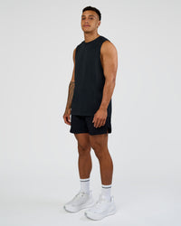 Man wearing Hybrid Lined 5" Short - Black-Shale Beige | Model:Daarian | Size:M