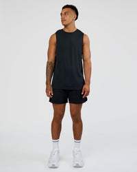 Man wearing Hybrid Lined 5" Short - Black-Shale Beige | Model:Daarian | Size:M