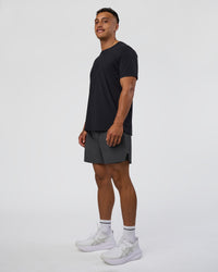 Man wearing Hybrid Lined 5" Short - Dark Storm | Model:Daarian | Size:M