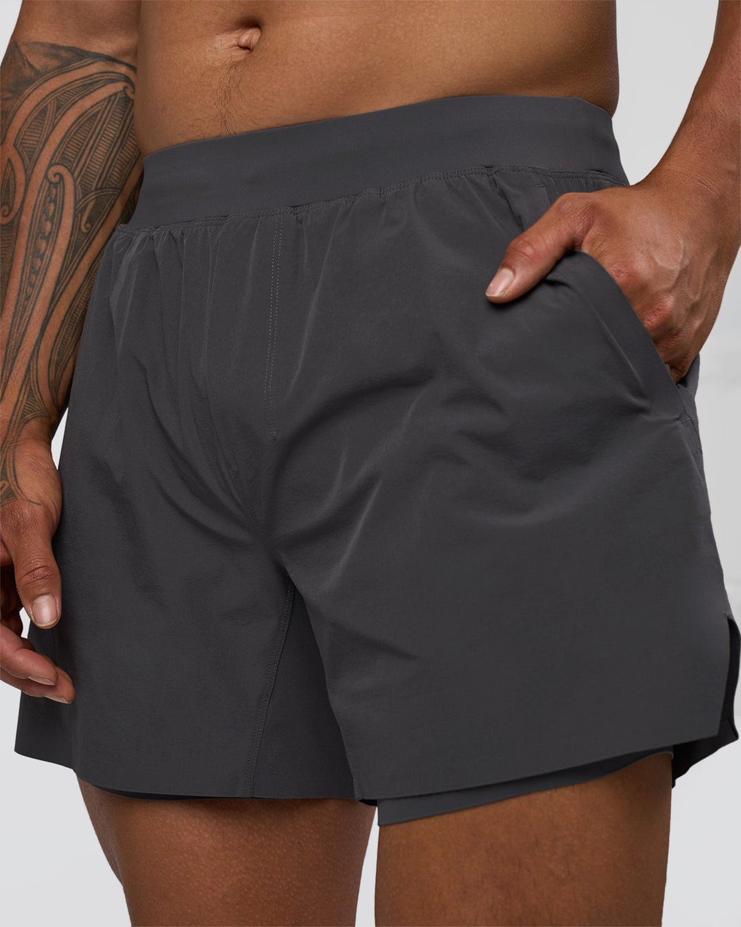 Man wearing Hybrid Lined 5" Short - Dark Storm | Model:Daarian | Size:M