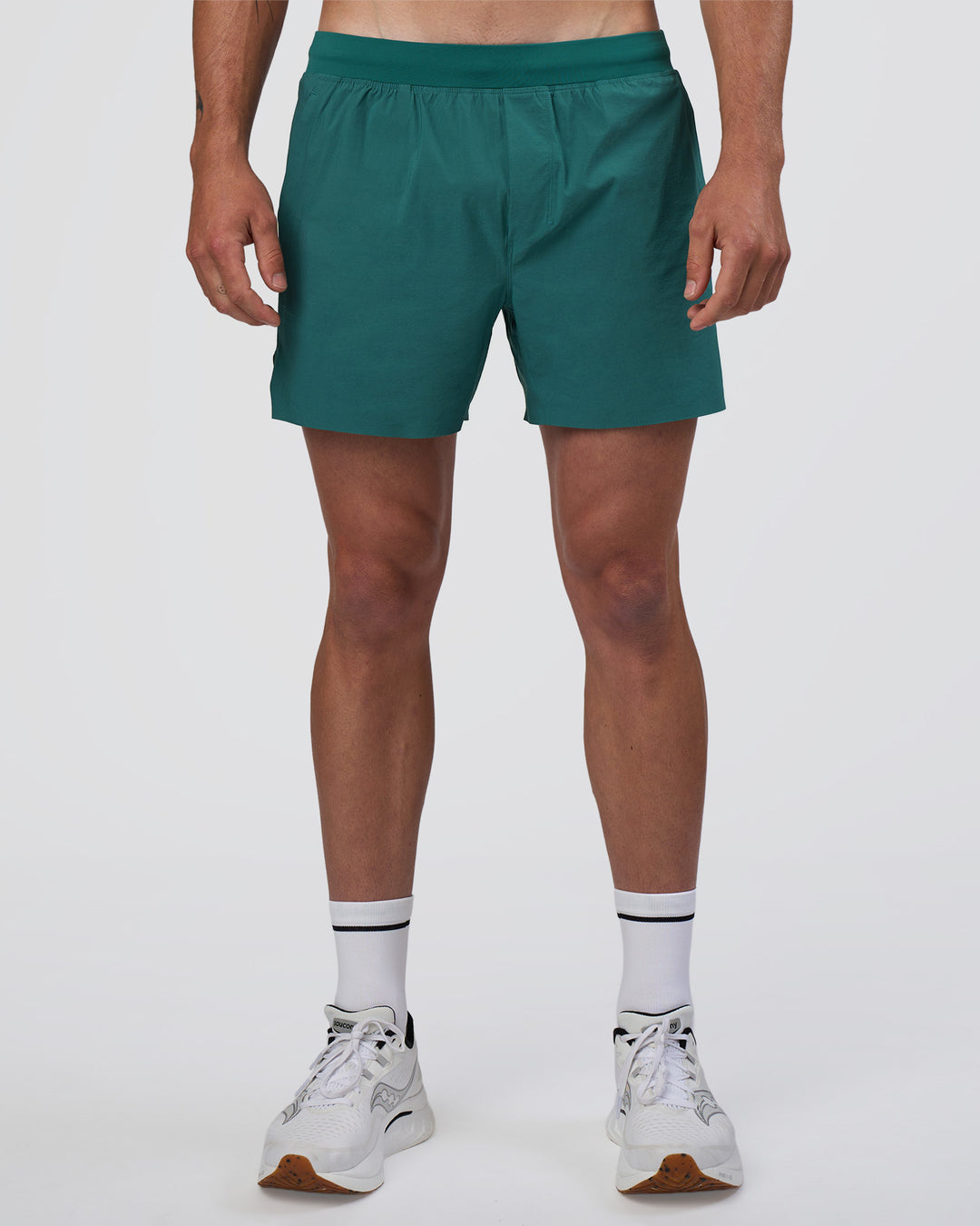 Man wearing Hybrid Lined 5" Short - Transformative Teal | Model:Konnor | Size:M