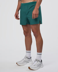 Man wearing Hybrid Lined 5" Short - Transformative Teal | Model:Konnor | Size:M