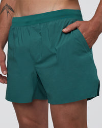 Man wearing Hybrid Lined 5" Short - Transformative Teal | Model:Konnor | Size:M