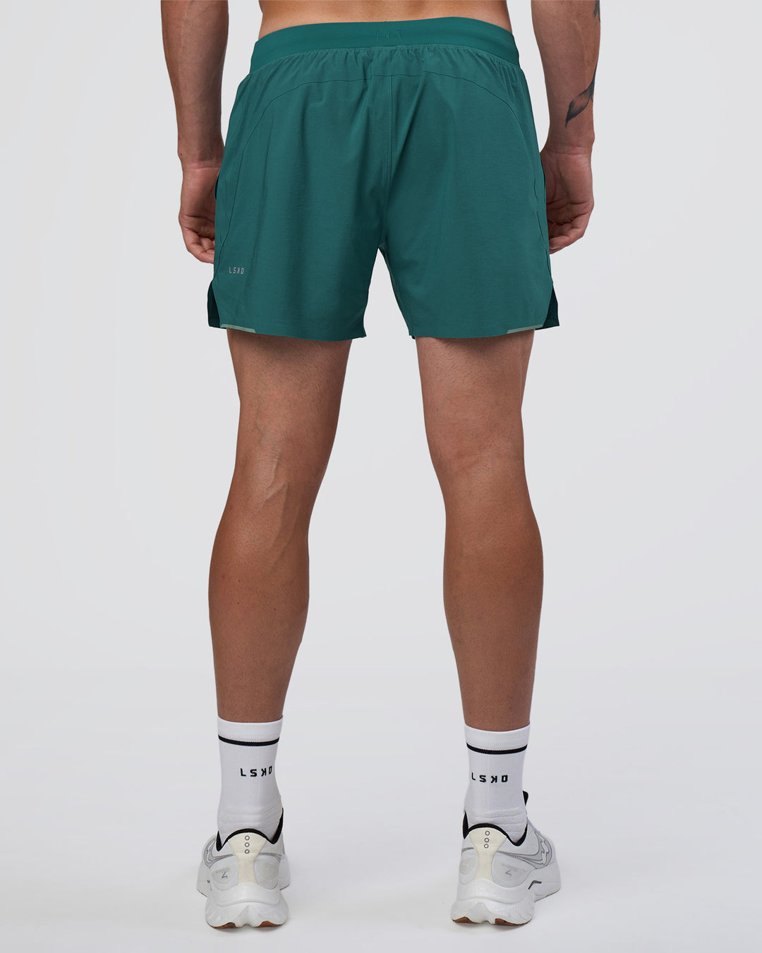 Man wearing Hybrid Lined 5" Short - Transformative Teal | Model:Konnor | Size:M