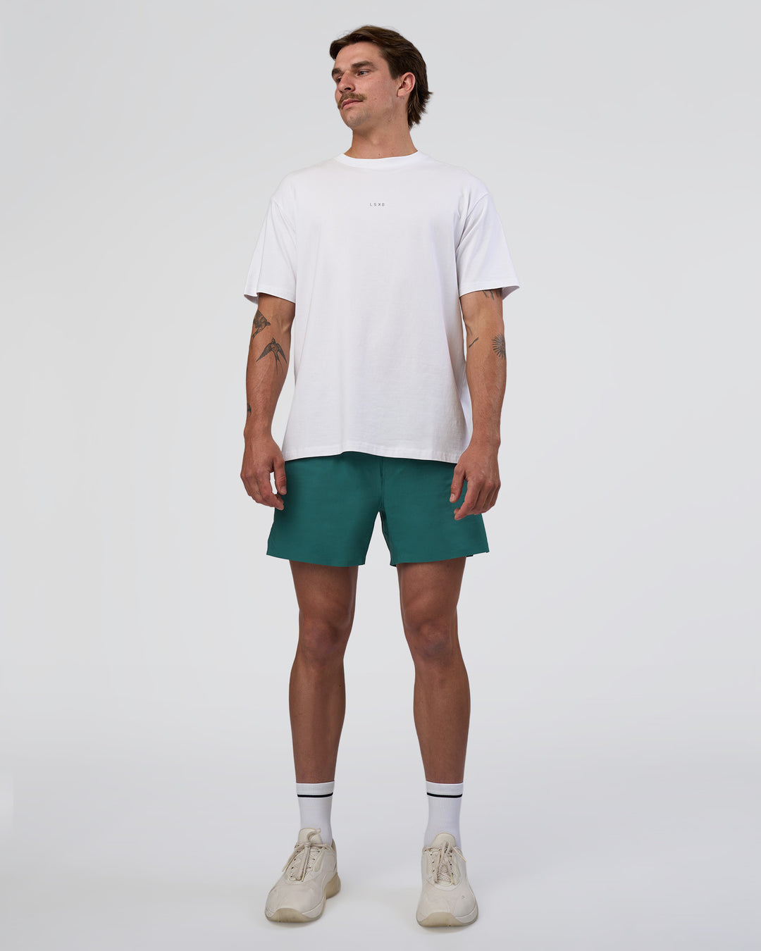 Man wearing Hybrid Lined 5" Short - Transformative Teal | Model:Konnor | Size:M