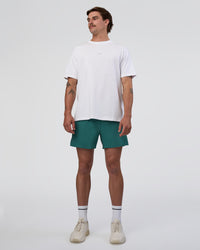 Man wearing Hybrid Lined 5" Short - Transformative Teal | Model:Konnor | Size:M