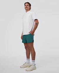 Man wearing Hybrid Lined 5" Short - Transformative Teal | Model:Konnor | Size:M