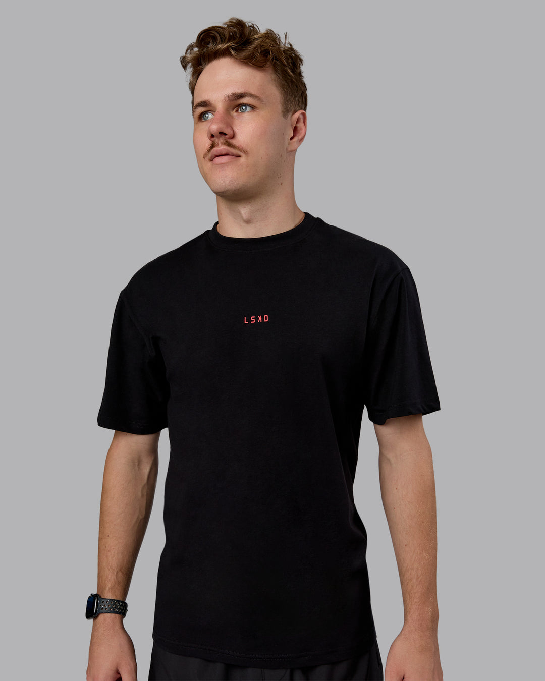 Man wearing Kettlebell Oversized Tee - Black-Scarlet | Model:Cameron | Size:M