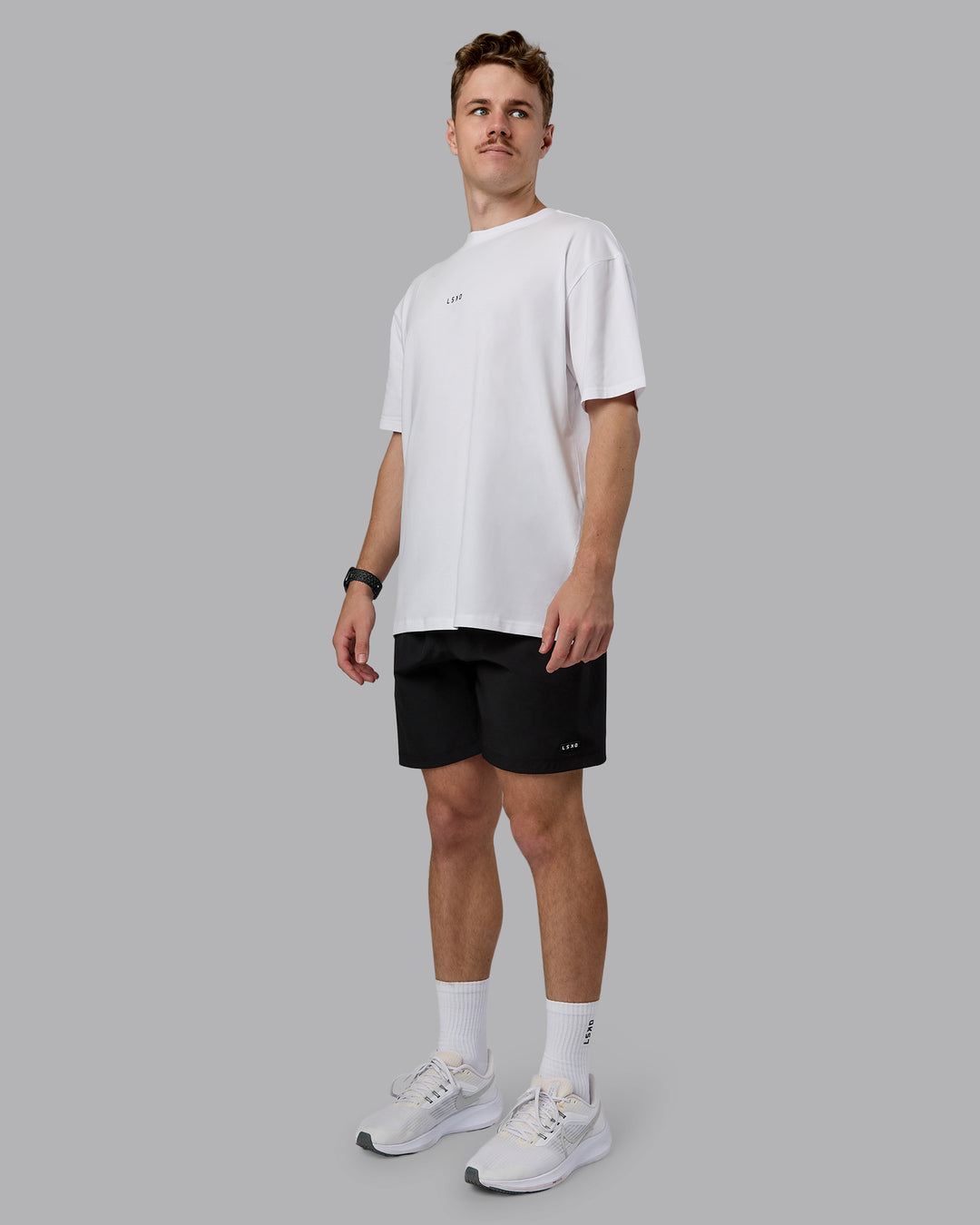 Man wearing Kettlebell Oversized Tee - White-Black | Model:Cameron | Size:M