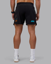 Man wearing Lift 6" Short - Black-Blue Atoll | Model:Jaiden | Size:M