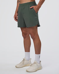 Man wearing Lift 6" Short - Carbon Green | Model:Konnor | Size:M