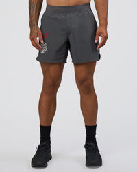 Man wearing Lift 6" Short - Dark Storm-Scarlet | Model:Daarian | Size:M