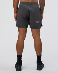 Man wearing Lift 6" Short - Dark Storm-Scarlet | Model:Daarian | Size:M