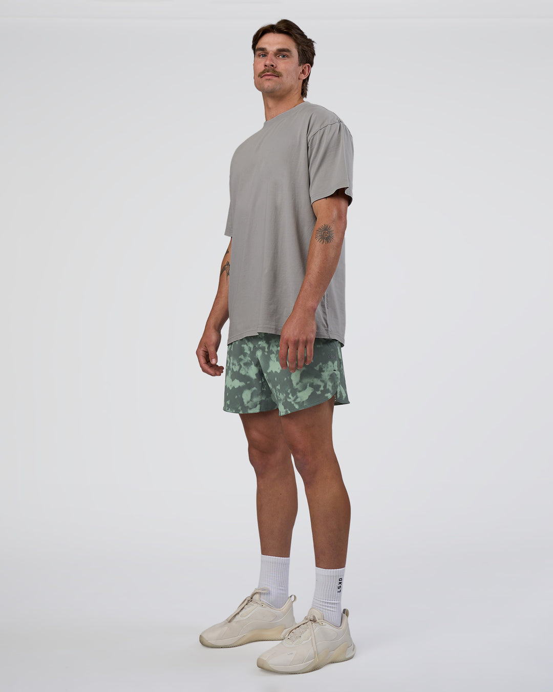 Man wearing Lift 6" Short - Washed Camo Carbon | Model:Konnor | Size:M
