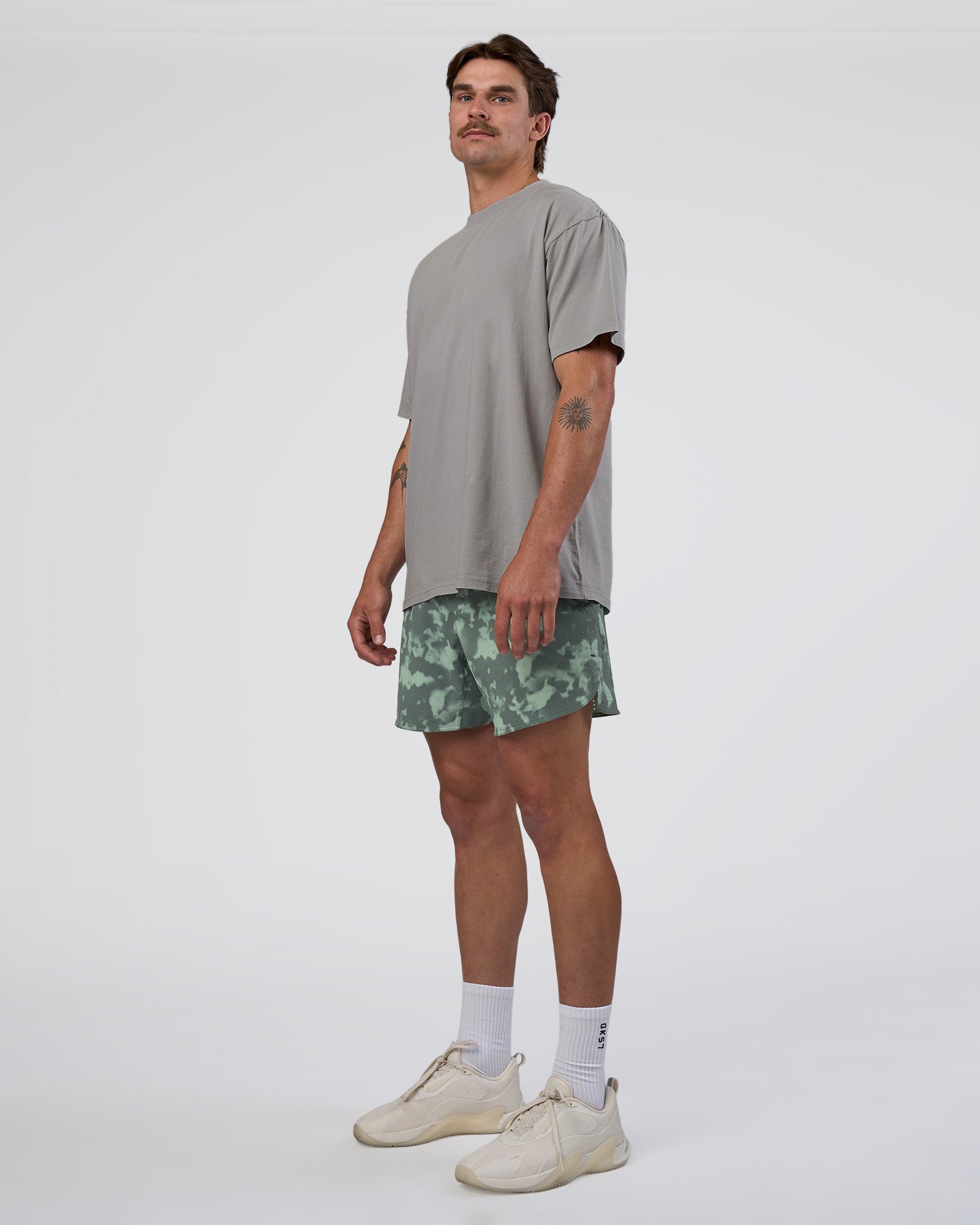 Man wearing Lift 6" Short - Washed Camo Carbon | Model:Konnor | Size:M