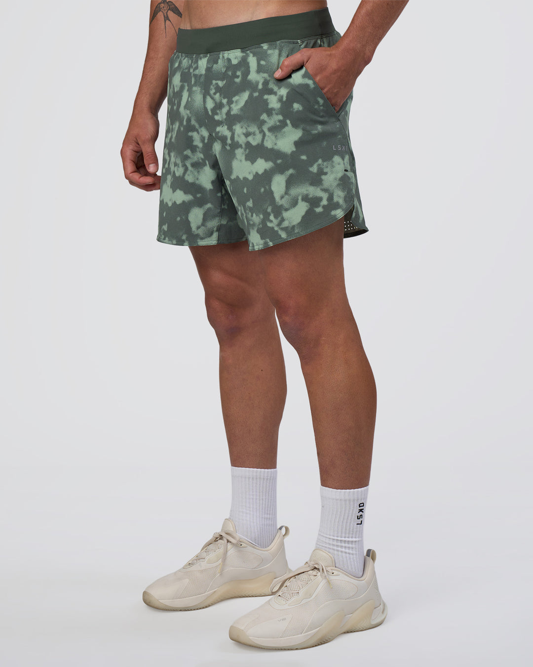Man wearing Lift 6" Short - Washed Camo Carbon | Model:Konnor | Size:M