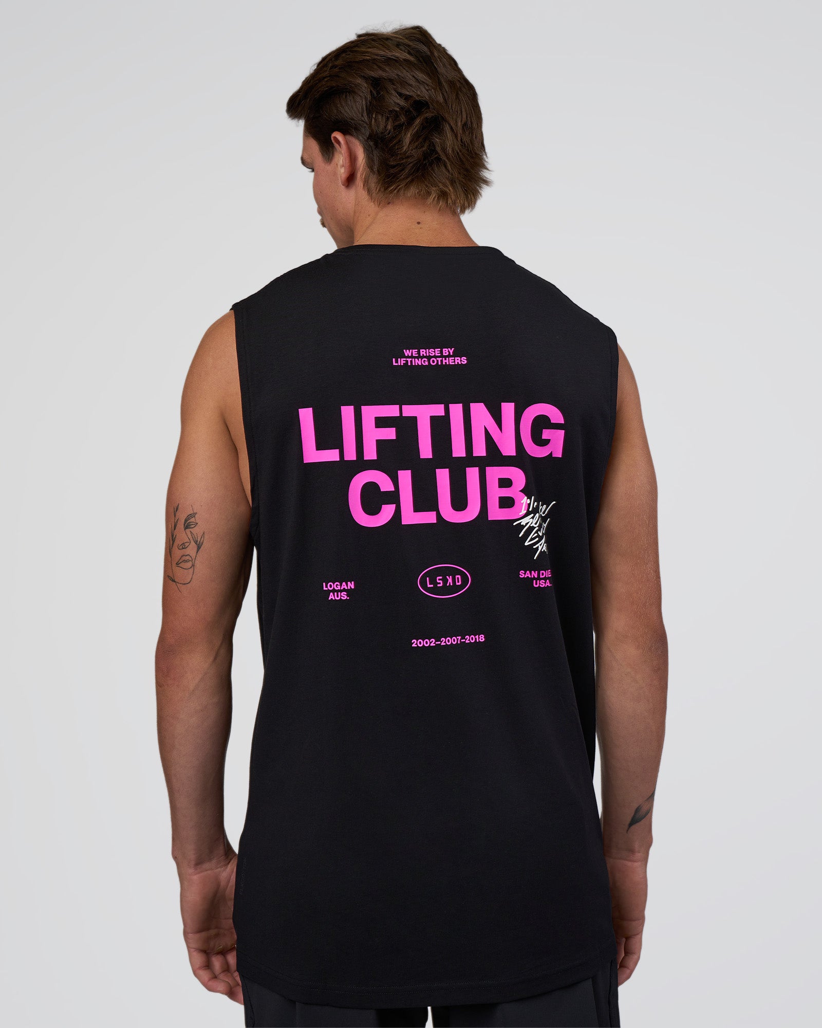 Man wearing Lifting Club FLXCotton Tank - Black-Ultra Fuchsia | Model:Konnor | Size:M