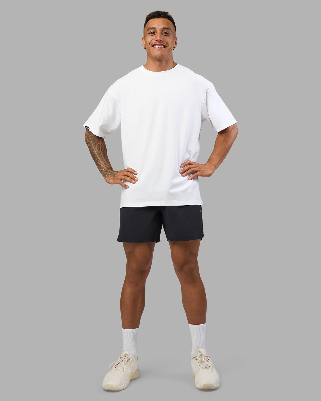 Man wearing Lilz Lifting Club FLXCotton Oversized Tee - White | Model:Daarian | Size:M