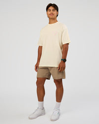 Man wearing Love The Process FLXCotton Oversize Tee - Off White-Marshmallow | Model:George | Size:M