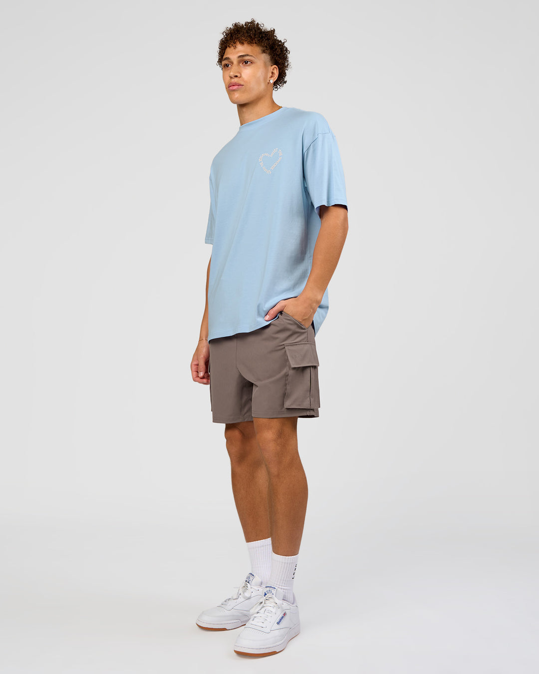 Man wearing Love The Process FLXCotton Oversize Tee - Open Air-Off White | Model:Leandro | Size:M