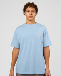 Man wearing Love The Process FLXCotton Oversize Tee - Open Air-Off White | Model:Leandro | Size:M