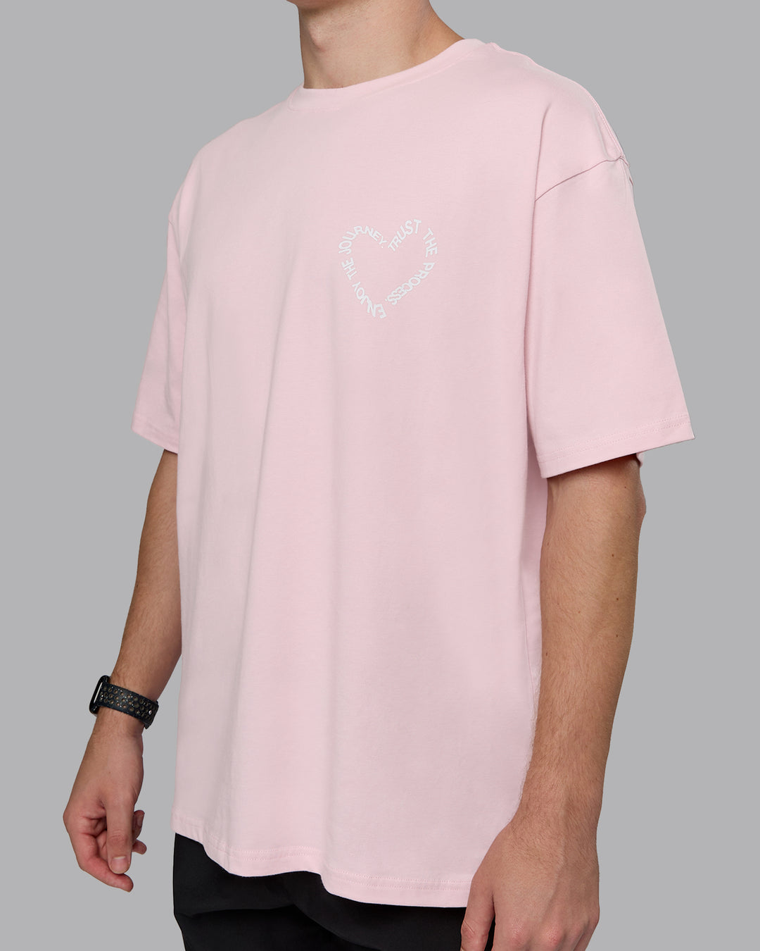 Man wearing Love The Process FLXCotton Oversize Tee - Petal Pink-White | Model:Cameron | Size:M