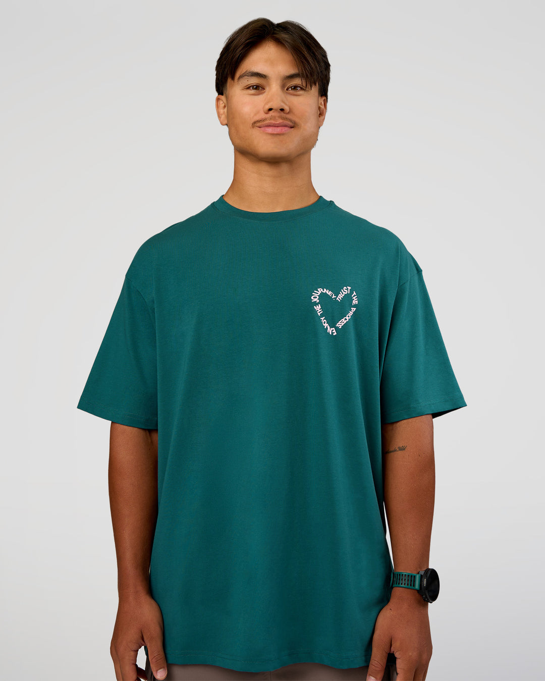 Man wearing Love The Process FLXCotton Oversize Tee - Transformative Teal-Marshmallow | Model:George | Size:M
