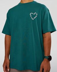 Man wearing Love The Process FLXCotton Oversize Tee - Transformative Teal-Marshmallow | Model:George | Size:M