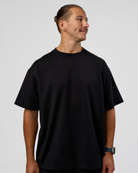 Man wearing MVP 2.0 Oversized Tee - Black | Model:Jaiden | Size:M