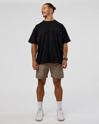Man wearing MVP 2.0 Oversized Tee - Black | Model:Jaiden | Size:M