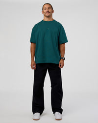 Man wearing MVP 2.0 Oversized Tee - Transformative Teal | Model:Jaiden | Size:M