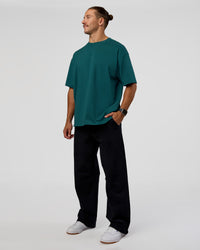 Man wearing MVP 2.0 Oversized Tee - Transformative Teal | Model:Jaiden | Size:M