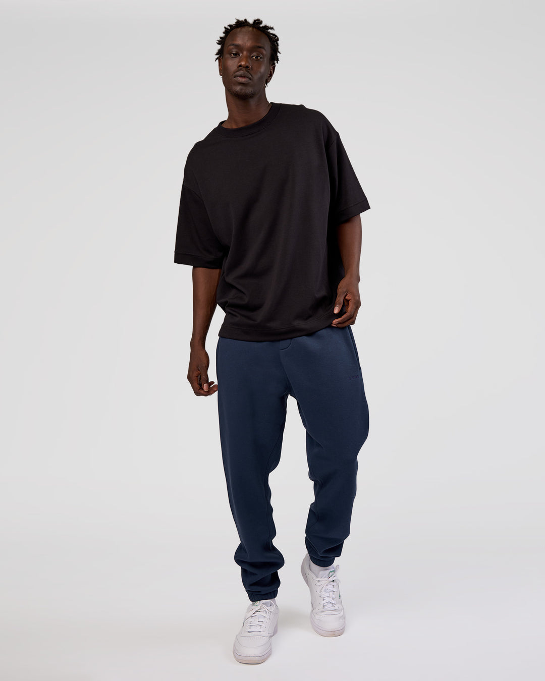 Man wearing MVP Cuffed Track Pant - Future Navy | Model:Okello | Size:M