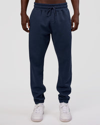 Man wearing MVP Cuffed Track Pant - Future Navy | Model:Okello | Size:M