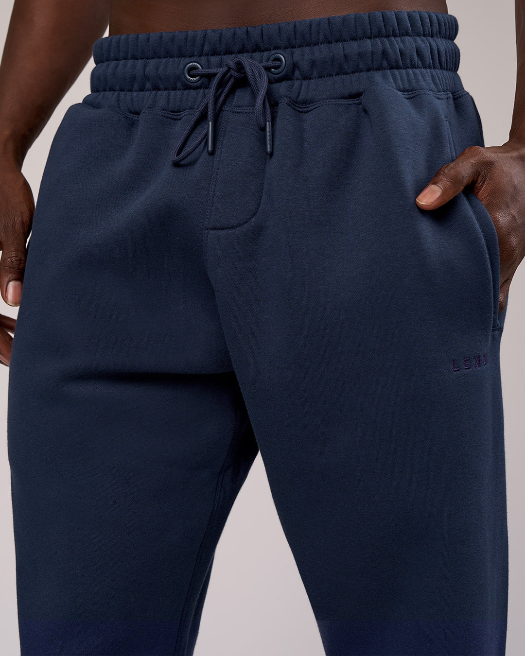 Man wearing MVP Cuffed Track Pant - Future Navy | Model:Okello | Size:M