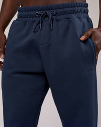 Man wearing MVP Cuffed Track Pant - Future Navy | Model:Okello | Size:M