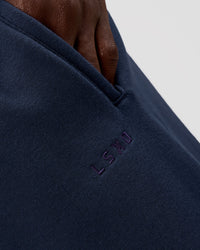 Man wearing MVP Cuffed Track Pant - Future Navy | Model:Okello | Size:M