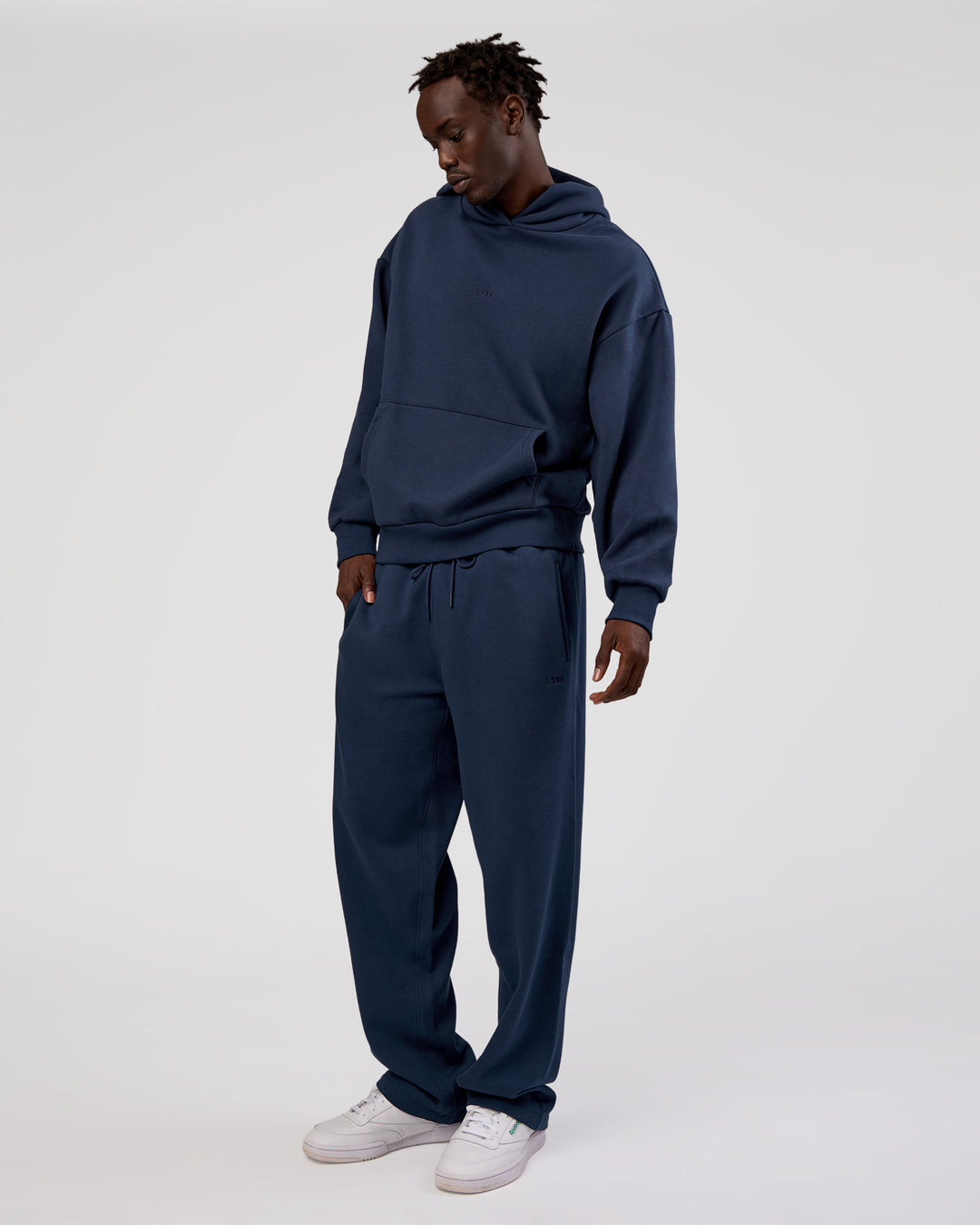 Man wearing MVP Oversized Hoodie - Future Navy | Model:Okello | Size:M