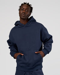 Man wearing MVP Oversized Hoodie - Future Navy | Model:Okello | Size:M