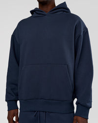 Man wearing MVP Oversized Hoodie - Future Navy | Model:Okello | Size:M