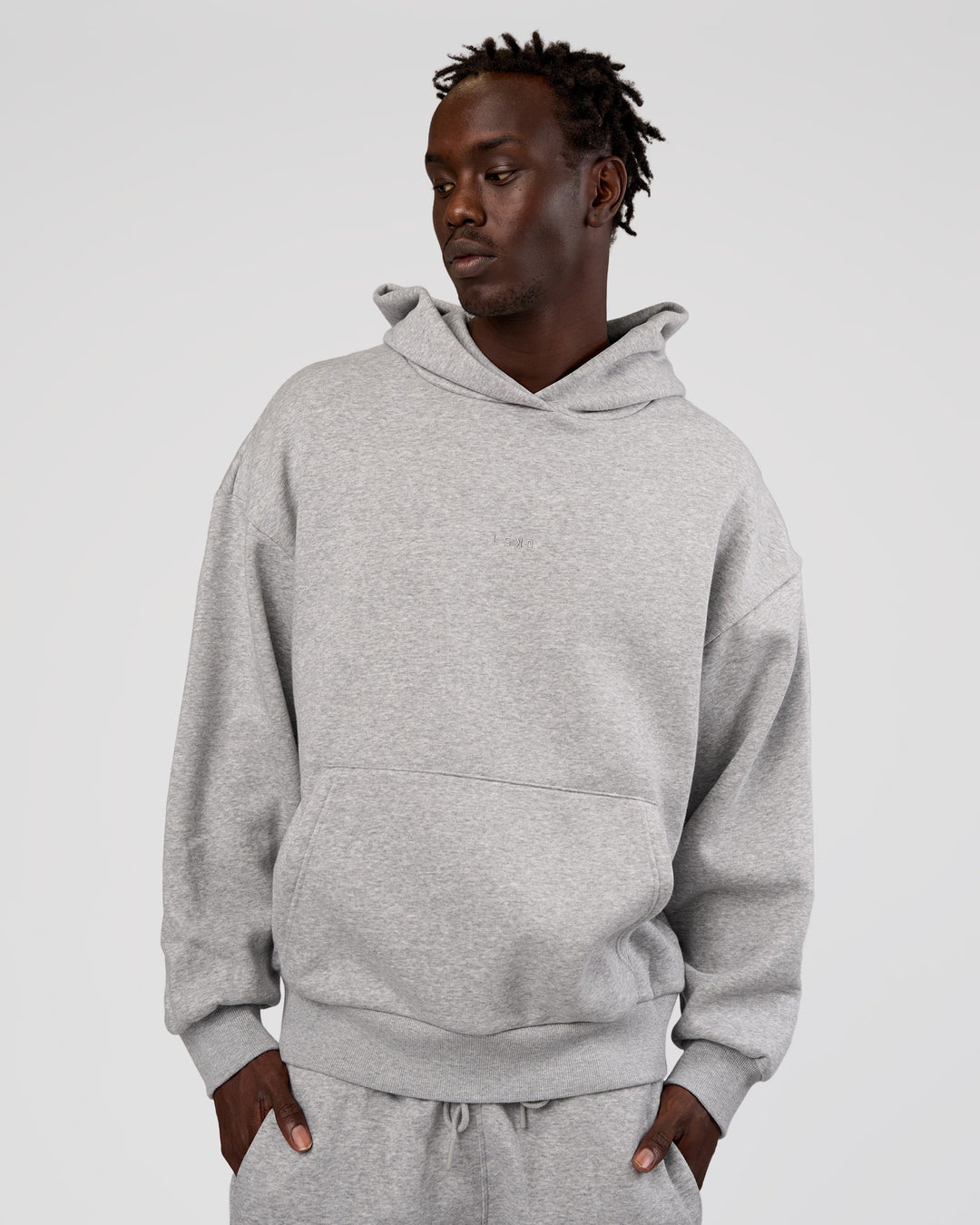 Man wearing MVP Oversized Hoodie - Light Grey Marl | Model:Okello | Size:M