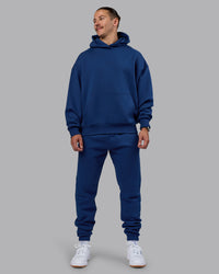 Man wearing MVP Oversized Hoodie - Midnight Blue | Model:Jaiden | Size:M