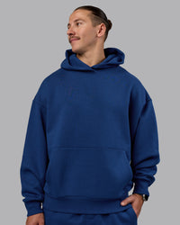 Man wearing MVP Oversized Hoodie - Midnight Blue | Model:Jaiden | Size:M